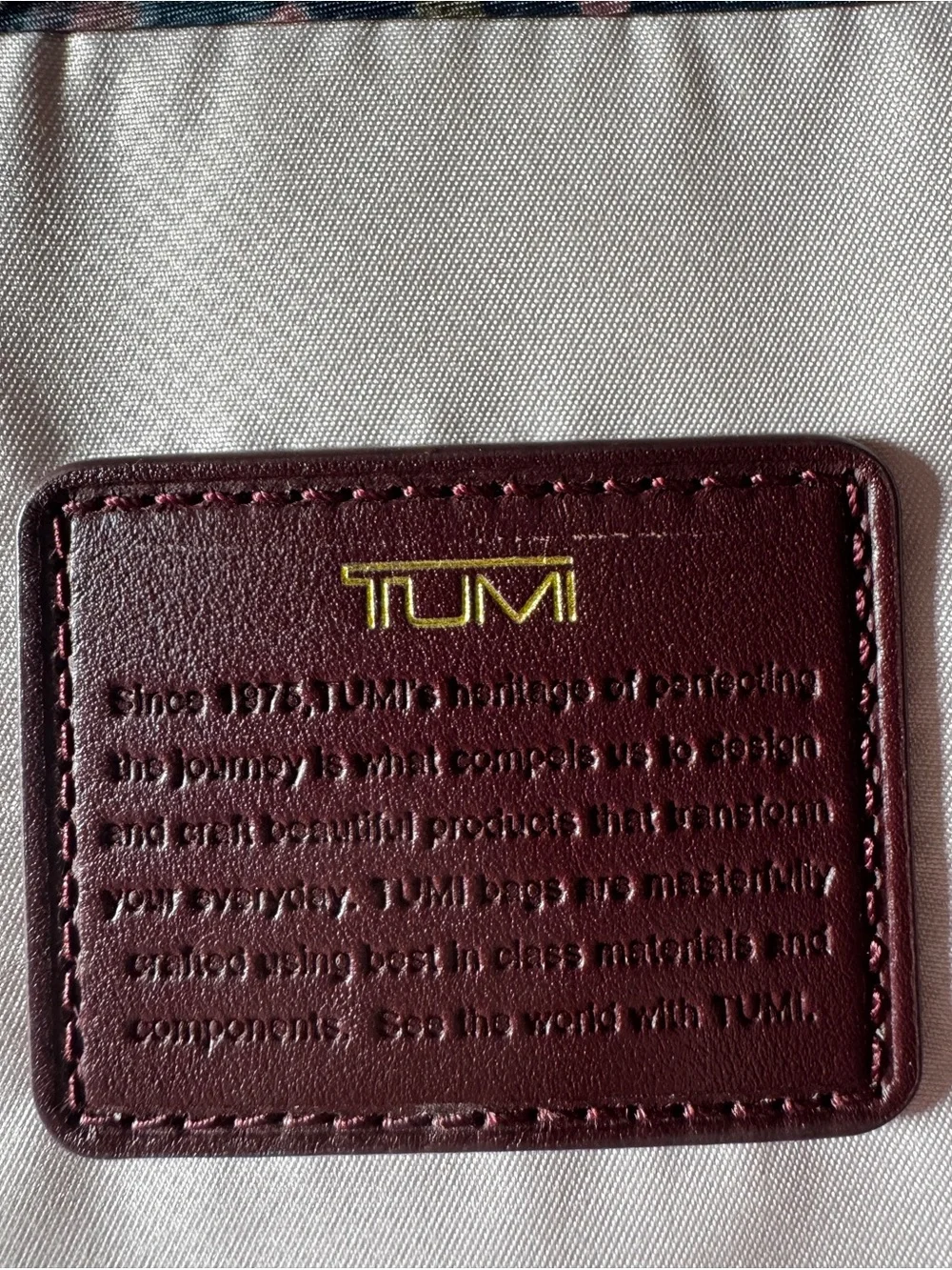TUMI Unisex Voyageur Hilden Beetroot color Backpack with Gold Hardware
